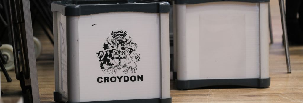 Metallic ballot boxes with Croydon council logo on one