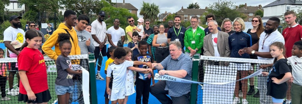 Jason Perry at ribbon cutting of parks reopening with some residents