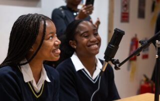 Some young people attend a podcast.