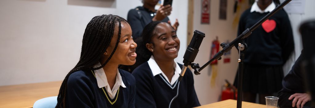 Some young people attend a podcast.