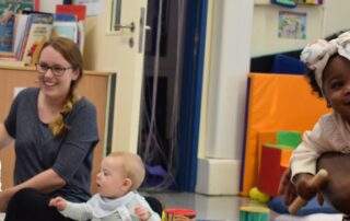 Photo of adults and children at a Croydon Family Hub