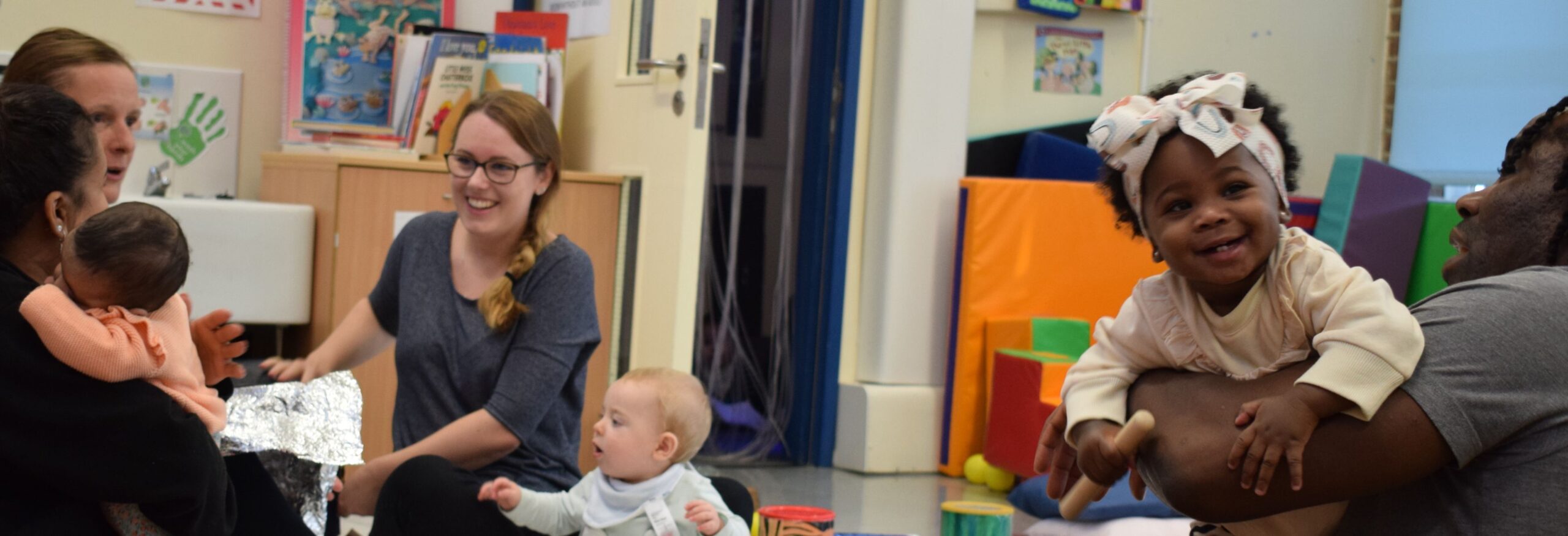 Photo of adults and children at a Croydon Family Hub