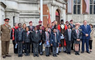 Group photo of schoolchildren with Civic and Executive Mayors at VE Day flag raising ceremony