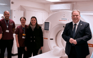 Mayor Perry and councillors stood with scanning equipment and NHS staff.