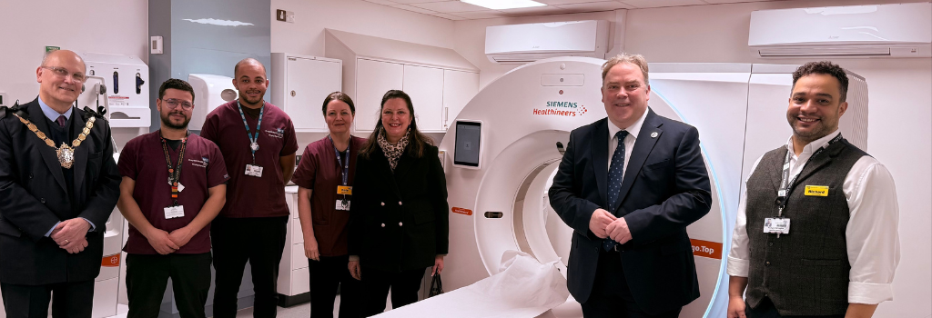 Mayor Perry and councillors stood with scanning equipment and NHS staff.
