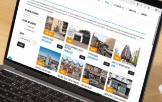 Laptop with Croydon Commercial website page open.