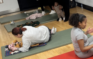 Mums and babies take part in a Let's Move exercise session.